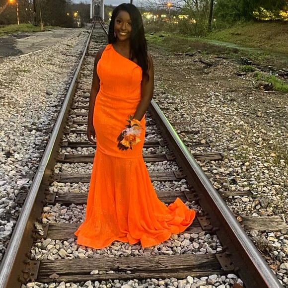 Yellow dress-$700;coral jumpsuit-$125;orange-$250; lavender-$175;cocktail-$60 - Picture 3 of 6